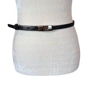 Women's black skinny adjustable leather belt with silver buckle